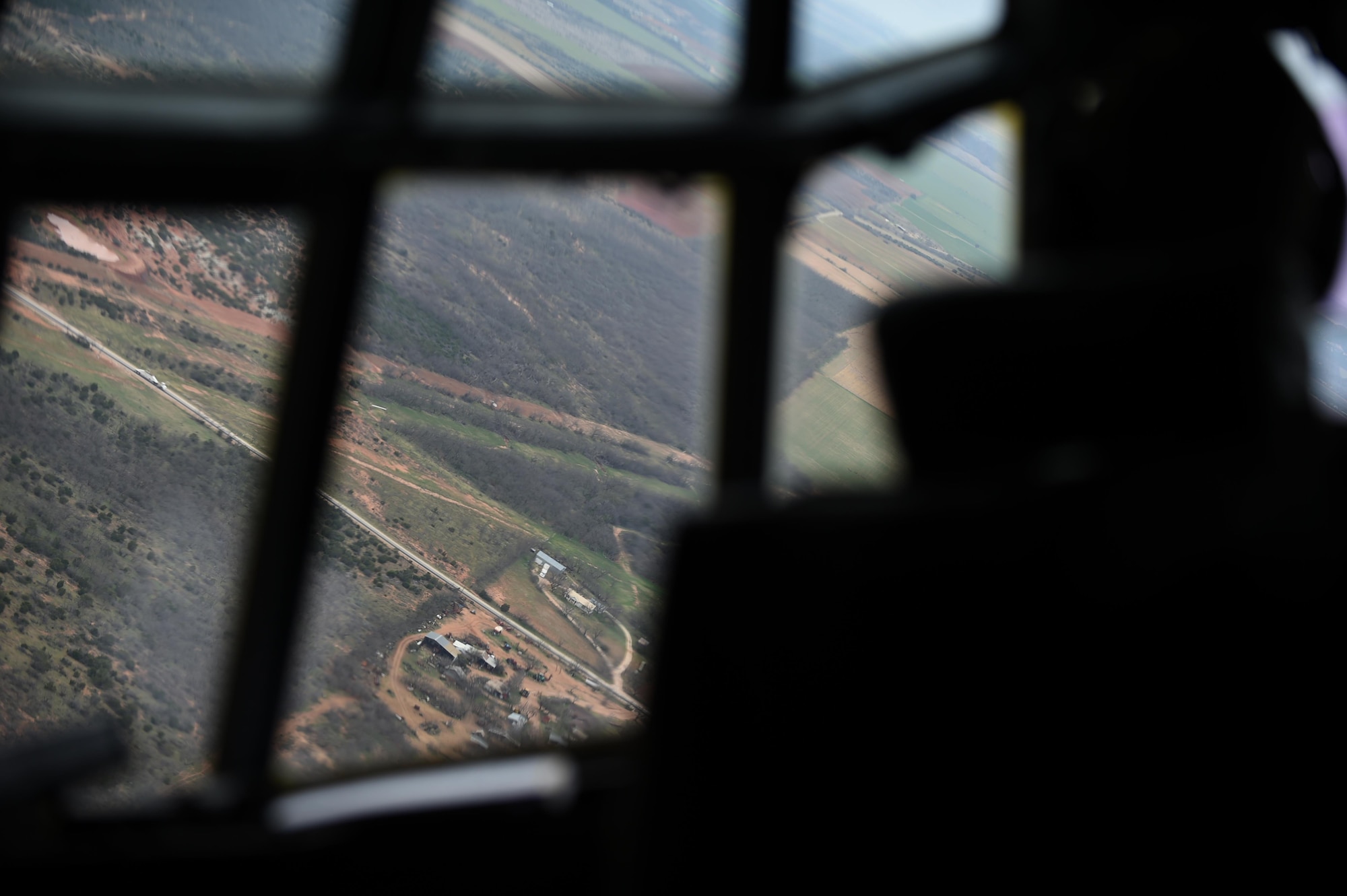 U.S. Air Force Capt. Jeff Schmidt, a 39th Airlift Squadron pilot maneuvers a C-130J Super Hercules into formation before performing an assault landing March 8, 2017, at Dyess Air Force Base, Texas. The 317th Airlift Group held a tactical airlift competition to test and improve combat tactics in a competitive environment with a split focus on pilot and loadmaster skills. (U.S. Air Force photo by Airman 1st Class Emily Copeland)