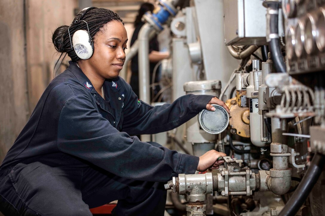 Navy Petty Officer 3rd Class Kenisha Sheppard aligns the USS Mesa Verde's engine for startup after a routine check in the Atlantic Ocean, March 4, 2017. Sheppard is an engineman. Navy photo by Petty Officer 2nd Class Brent Pyfrom