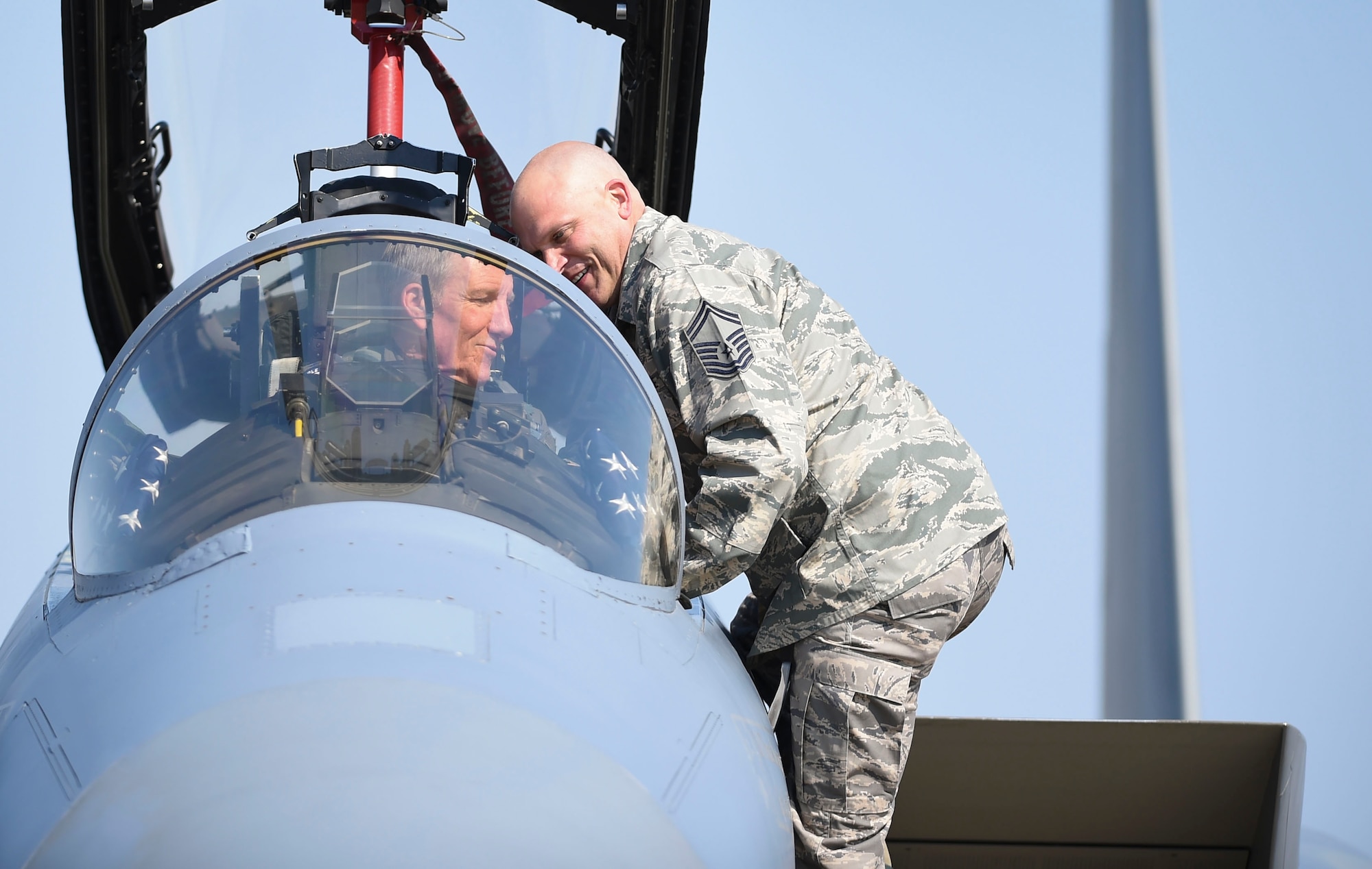 Photo of Gen. Herbert “Hawk” Carlisle, goes over a preflight maintenance check prior to his final flight