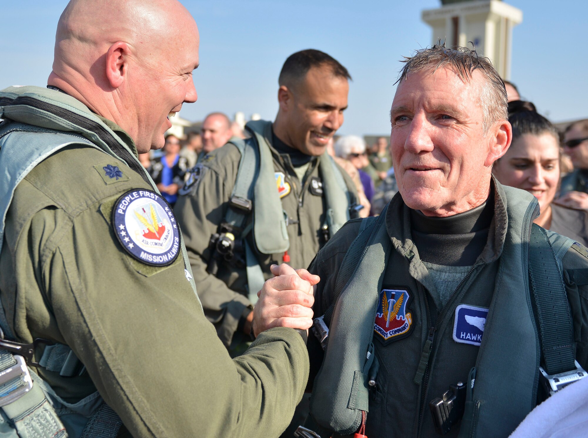 Photo of Gen. Herbert “Hawk” Carlisle, greeted by Airmen, his friends and family after taking his final flight