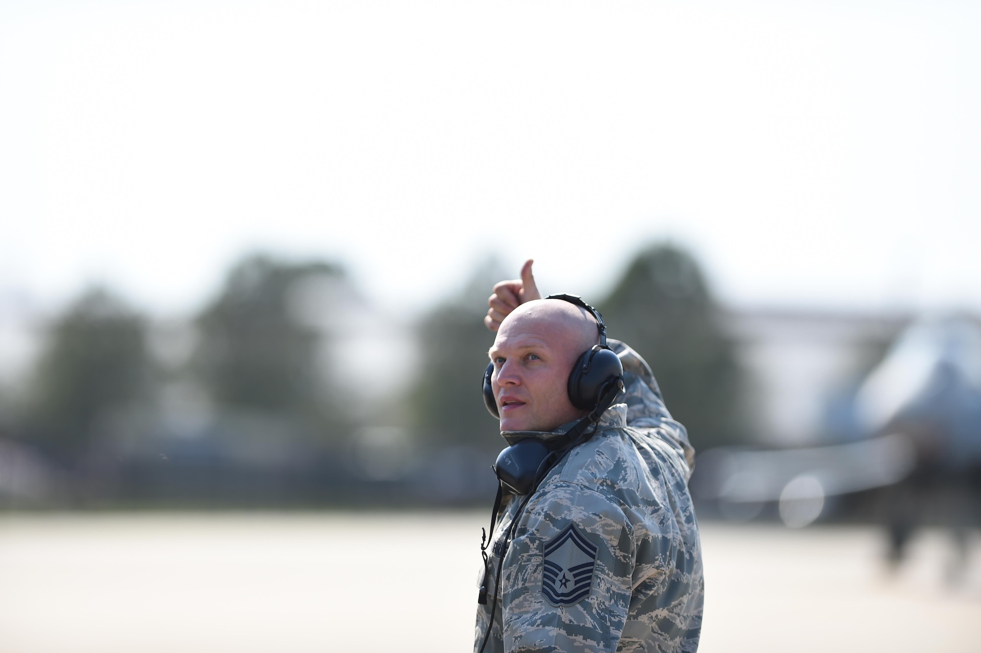 Photo of  Senior Master Sgt. Jeffrey Zimmerman, giving Gen. Herbert “Hawk” Carlisle, a thumbs-up during Carlisle’s final flight