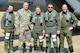 U.S. Air Force Gen. Herbert “Hawk” Carlisle, commander of Air Combat Command, poses with fellow pilots and his former crew chief, before his final flight at Joint Base Langley-Eustis, Va., March 10, 2017. Carlisle’s fini-flight culminated his more than 39 years of service to the U.S. Air Force and his country. (U.S. Air Force photo/Airman 1st Class Derek Seifert)