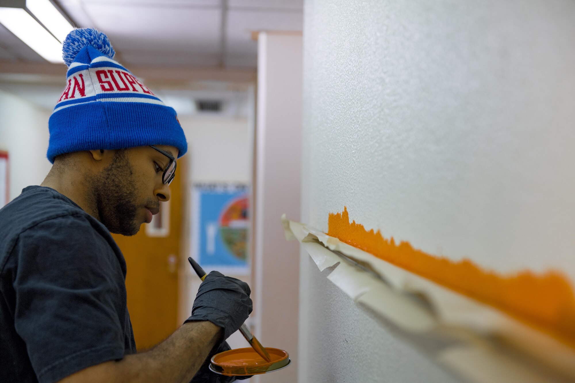 Airmen from the 374th Logistics Readiness Squadron’s Petroleum Oil Lubricants flight paints a wall at West Elementary School during a volunteer event on March 4, 2017, at Yokota Air Base, Japan. The intent of the new paint was to help brighten the children’s learning environment. (U.S. Air Force photo by Airman 1st Class Donald Hudson)