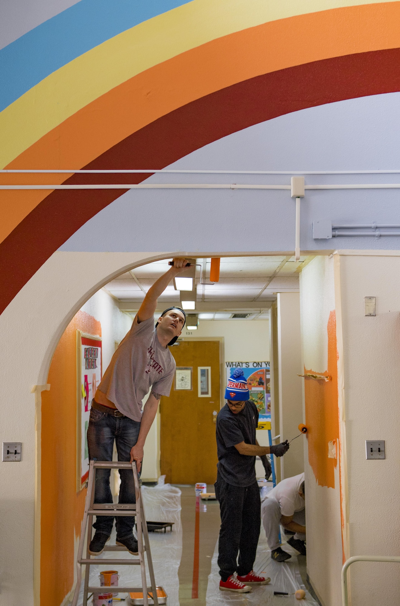 Airmen from the 374th Logistics Readiness Squadron’s Petroleum Oil Lubricants flight paints a wall at West Elementary School during a volunteer event on March 4, 2017, at Yokota Air Base, Japan. The intent of the new paint was to help brighten the children’s learning environment. (U.S. Air Force photo by Airman 1st Class Donald Hudson)