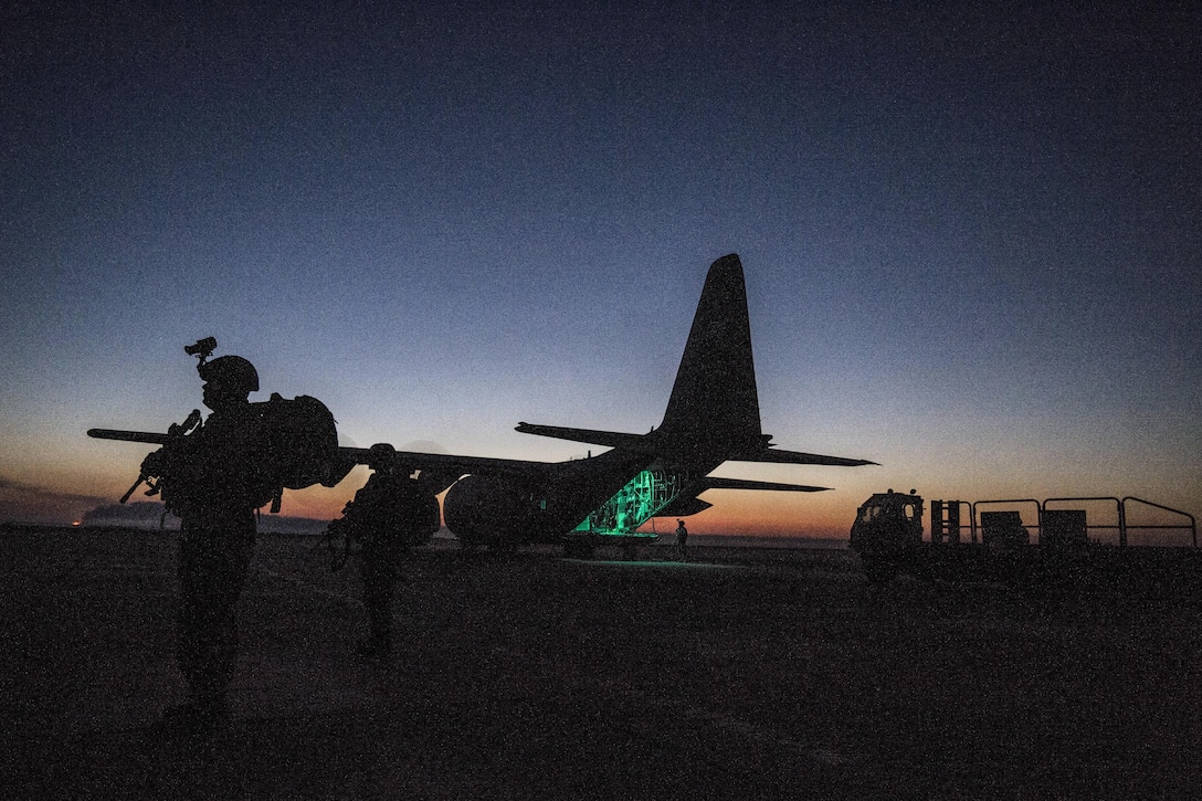 An airman secures the area around a C-130 Hercules while crews load cargo to support a Combined Joint Task Force Operation Inherent Resolve mission from an undisclosed location, March 7, 2017. The airman is assigned to the 379th Expeditionary Security Forces Squadron Fly Away Security Team. Air Force photo by Staff Sgt. Matthew B. Fredericks