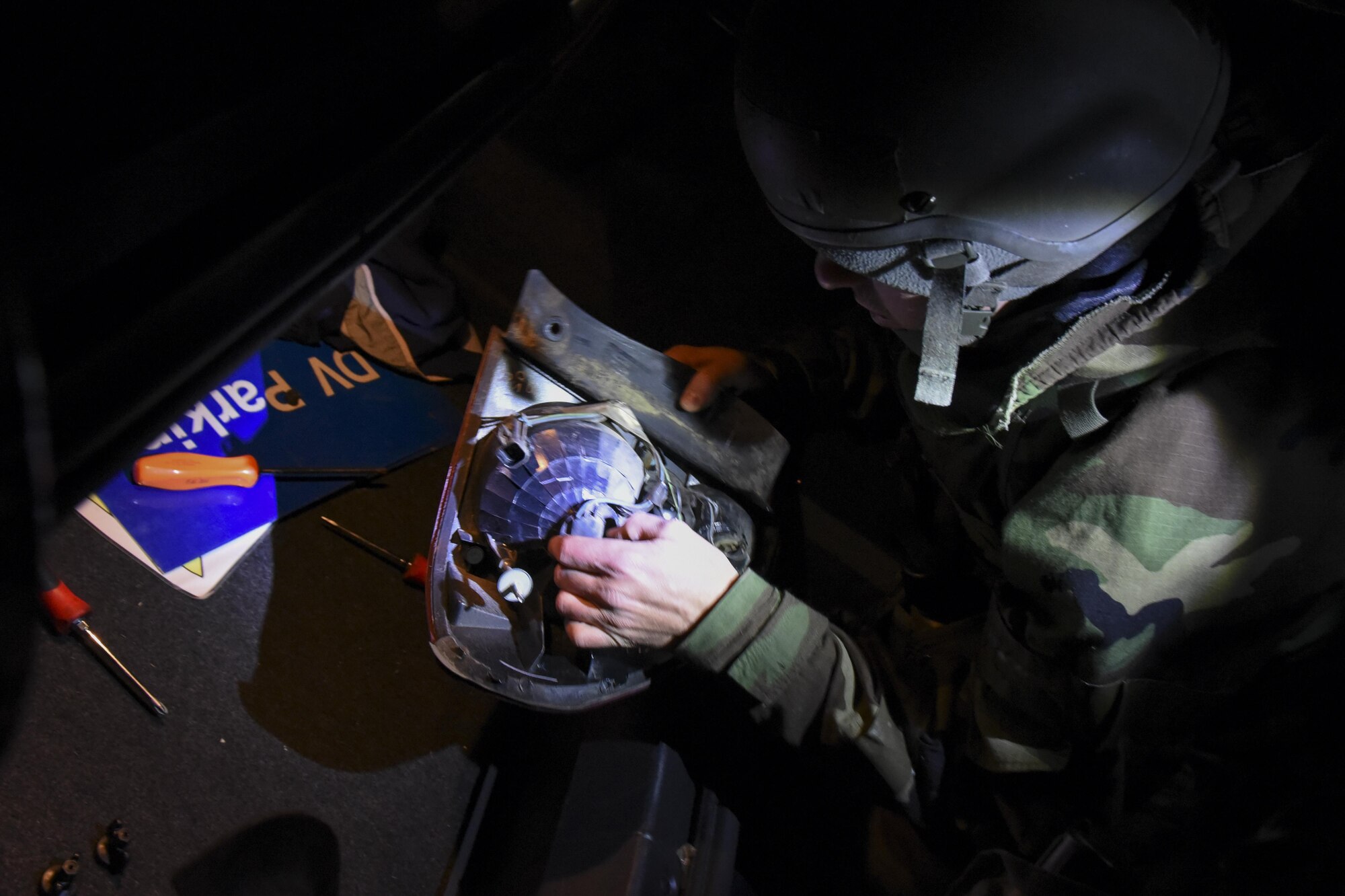 U.S. Air Force Airman 1st Class Michael Lubick, 8th Logistics Readiness Squadron fire truck and refueller mechanic, removes a bulb from a taillight during exercise Beverly Pack 17-2, a no-notice training exercise at Kunsan Air Base, Republic of Korea, March 7, 2017. Lubick is responsible for maintaining vehicles to ensure airmen can perform their daily tasks in support of the 8th Fighter Wing mission. (U.S. Air Force photo by Senior Airman Michael Hunsaker/Released)