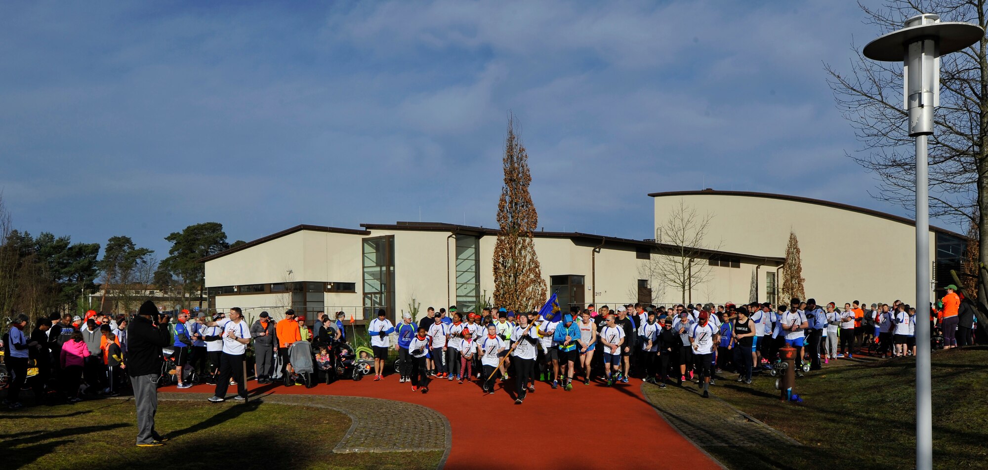 Approximately 300 runners and spectators gather around the starting point of the 6th annual memorial 5K in honor of Airman 1st Class Zachary Cuddeback on Ramstein Air Base, Germany, Mar. 4, 2017. All proceeds raised by the event were donated on behalf of Airman Cuddeback to the United Service Organizations, Fisher House Foundation, American Red Cross, and the Wounded Warrior Project. (U.S. Air Force photo by Airman 1st Class D. Blake Browning)