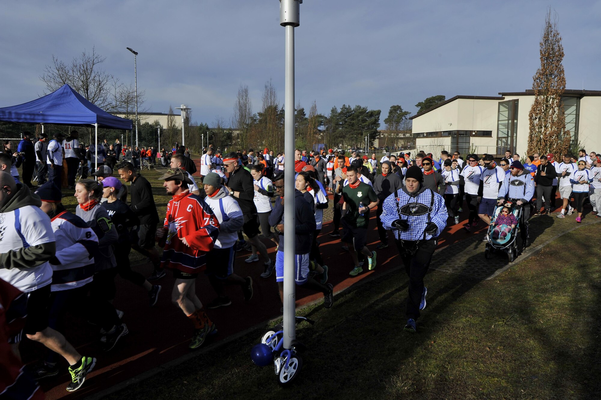 The starting horn sounds and runners take off as the 6th annual memorial 5K in honor of Airman 1st Class Zachary Cuddeback begins on Ramstein Air Base, Germany, Mar. 4, 2017. Airman Cuddeback’s life was taken during a routine air crew run at Frankfurt International Airport in March of 2011. (U.S. Air Force photo by Airman 1st Class D. Blake Browning)