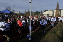 The starting horn sounds and runners take off as the 6th annual memorial 5K in honor of Airman 1st Class Zachary Cuddeback begins on Ramstein Air Base, Germany, Mar. 4, 2017. Airman Cuddeback’s life was taken during a routine air crew run at Frankfurt International Airport in March of 2011. (U.S. Air Force photo by Airman 1st Class D. Blake Browning)