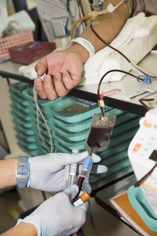 Blood is drawn from a local volunteer during a blood drive at Marine Corps Air Station Iwakuni, Japan, March 7, 2017. A total of 59 donors gave 400 milliliters of blood ending with approximately 24,000 milliliters donated. The blood drive is a biannual event that is held in March and August. (U.S. Marine Corps photo by Pfc. Stephen Campbell)