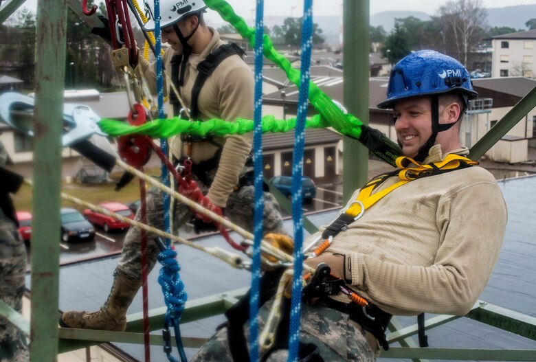 Staff Sgt. Ryan Unger, 1st Communications Maintenance Squadron cable and antenna systems team lead, leans back on his positioning lanyard during tower rescue and climbing training on Ramstein Air Base, Germany, March 9, 2017. The training is required yearly to remain certified in climbing. (U.S Air Force photo by Senior Airman Tryphena Mayhugh)