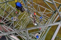 Airmen assigned to the 1st Communications Maintenance Squadron participate in tower rescue and climbing training on Ramstein Air Base, Germany, March 9, 2017. In order to be certified as a climber, 1 CMXS Airmen must also be certified in rescues. (U.S Air Force photo by Senior Airman Tryphena Mayhugh)