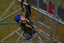 Senior Airman Jordan Watson, 1st Communications Maintenance Squadron cable and antenna theater maintenance technician, adjusts his positioning lanyard during tower rescue and climbing training on Ramstein Air Base, Germany, March 9, 2017. The main focus of the training was on the rescue aspect, but it also provided a refresher for basic climbing techniques. (U.S Air Force photo by Senior Airman Tryphena Mayhugh)