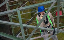 Master Sgt. Stephen Maclin, 1st Communications Maintenance Squadron NCO in charge of cable and antenna maintenance, touches his nose for a “scared of heights” test during tower rescue and climbing training on Ramstein Air Base, Germany, March 9, 2017. The test consisted of leaning all the way back from the tower and removing one foot at a time while touching your nose. It is a requirement for every first-time climber. (U.S Air Force photo by Senior Airman Tryphena Mayhugh)