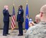 At left, the commander of the 932nd Medical Group, Col. Leon Barringer, performs the oath of enlistment to Chief Master Sgt. Robert Cutchins after his new chief's stripe was put on. The colonel recognized the dedication and contributions of both the chief and his family in a special promotion ceremony held March 5, 2017. A packed room of fellow Airmen came out to witness the event on Scott Air Force Base, near Belleville, Illinois. Chief Cutchins is the Superintendent of Health Services Management at the 932nd Medical Squadron, 932nd Medical Group. The 932nd MDS trains and equips 188 medical personnel on the performance of duties associated with the Expeditionary Medical Support (EMEDS) mission. (U.S. Air Force photo by Lt. Col. Stan Paregien)