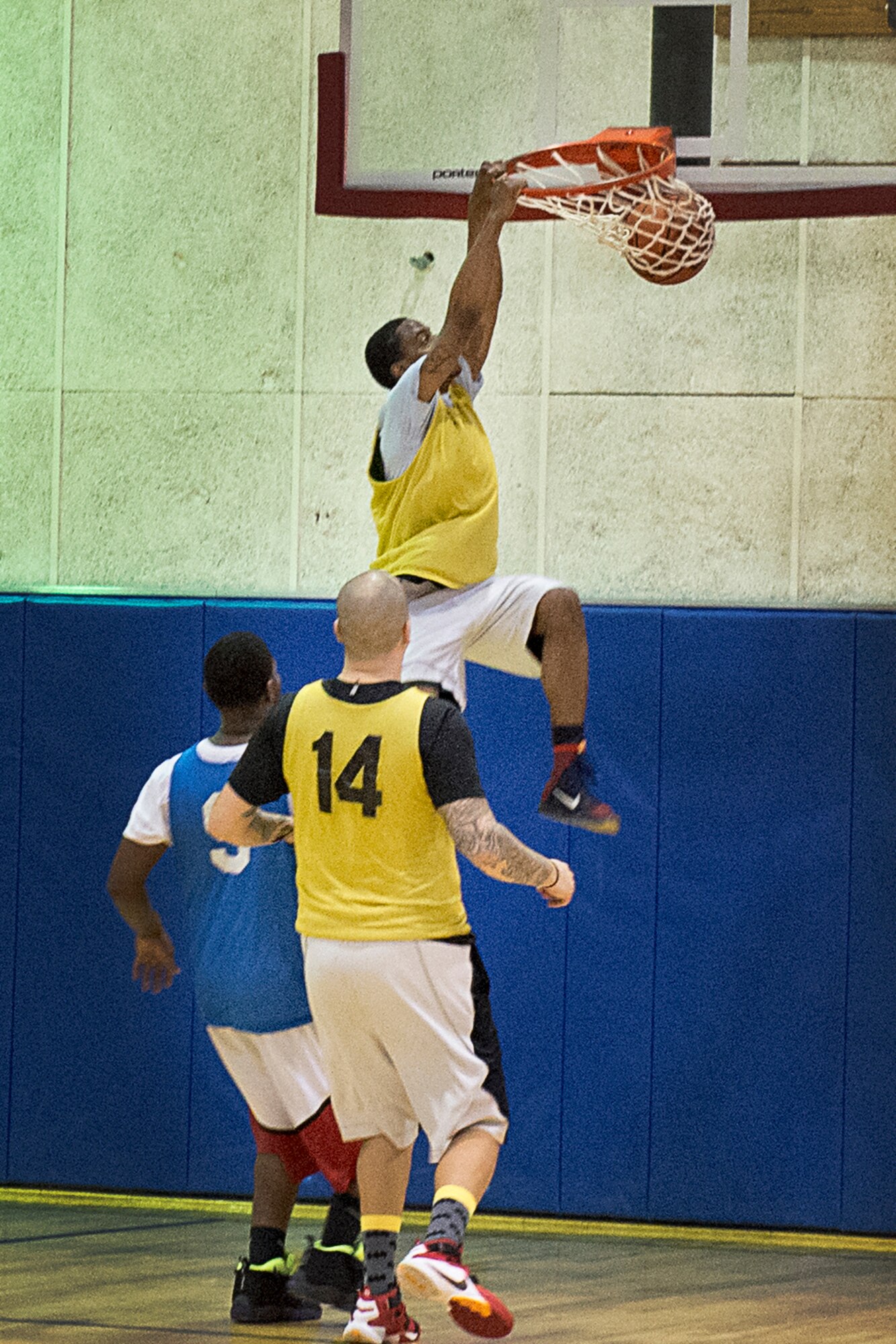 William Berry, 434th Security Forces Squadron player, slams one home March 4, 2016 at Grissom Air Reserve Base, Ind. Berry and his SFS Defender teammates held off a scrappy 434th Maintenance Squadron team 50-47 to win the base’s annual basketball tournament. (U.S. Air Force photo/Senior Airman Cali Wetli)