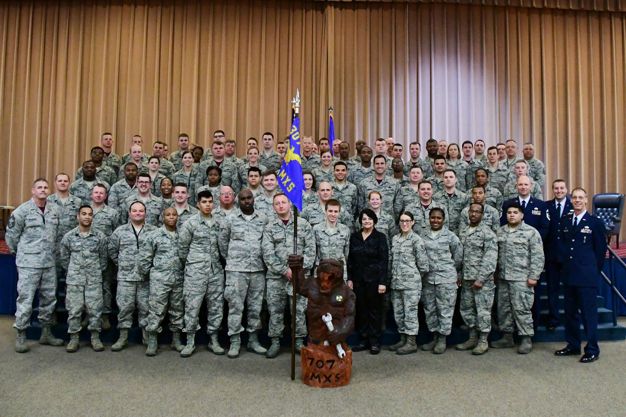 The 707th Maintenance Squadron welcomes the new Honorary Commander, Catherine Vanderberry, after the 707th MXS Honorary Commander Induction Ceremony at Barksdale Air Force Base, La. March 5, 2017. At the end of the ceremony a new unofficial mascot, the “swamp rat,” was also unveiled. (U.S. Air Force photo by Master Sgt. Dachelle L. Melville/Released)