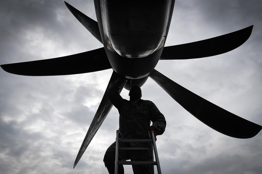 Tech. Sgt. Rainier Howard, 374th Aircraft Maintenance Squadron crew chief, performs preflight inspection of a C-130J Super Hercules at Kadena Air Base, Japan, March 6, 2017. This is the first C-130J to be assigned to Pacific Air Forces. Yokota serves as the primary Western Pacific airlift hub for U.S. Air Force peacetime and contingency operations. Missions include tactical air land, airdrop, aeromedical evacuation, special operations and distinguished visitor airlift. (U.S. Air Force photo by Staff Sgt. Michael Smith)