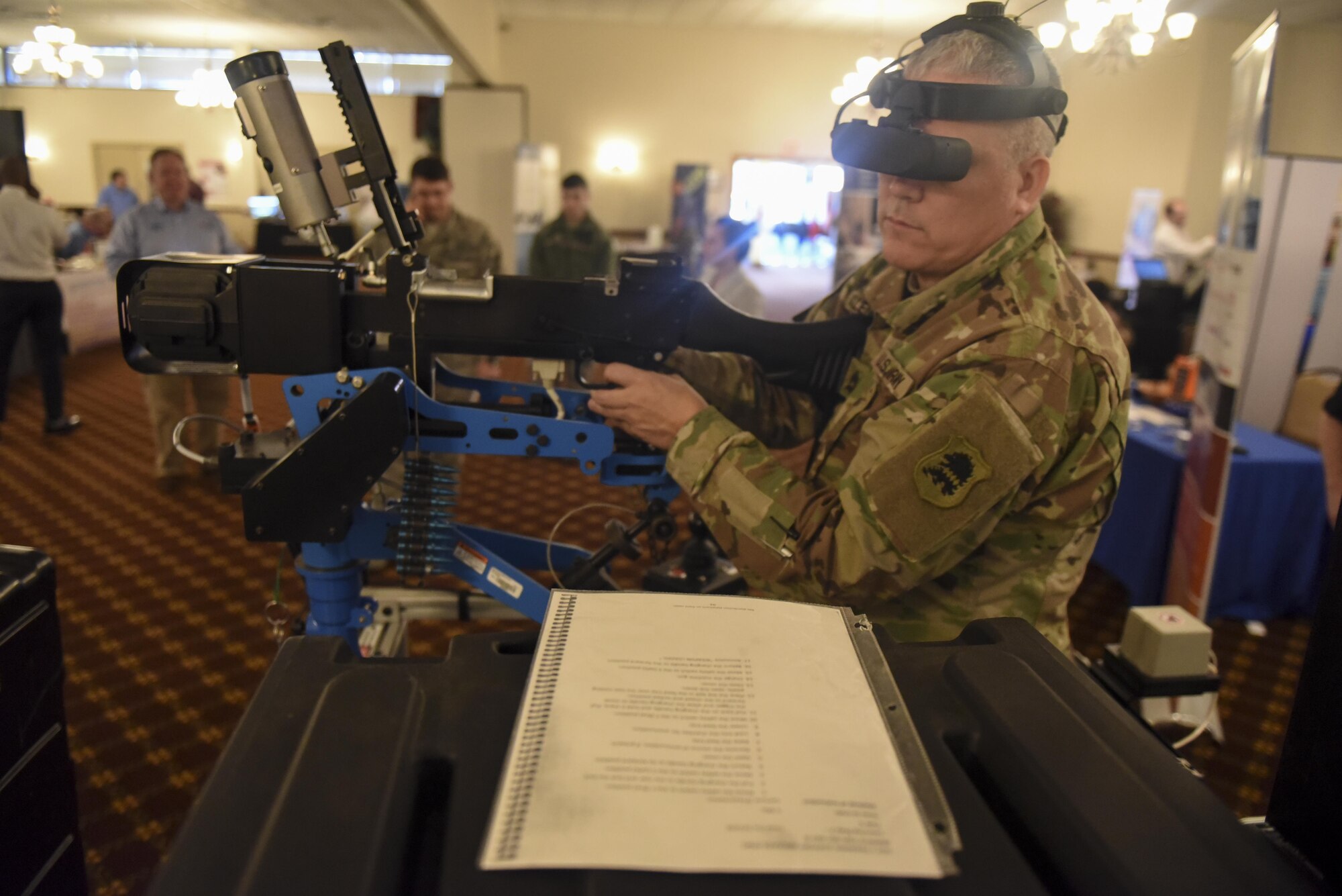 U.S. Army Sgt. 1st Class Arthur Valenzuela-Bradley Jr. demonstrates virtual mounted machine gun training at the 2017 Joint Base McGuire-Dix-Lakehurst Technology Expo here, March 9. The new technology allows servicemembers to become familiar with the mounted weapon systems without spending additional funds on ammunition. 