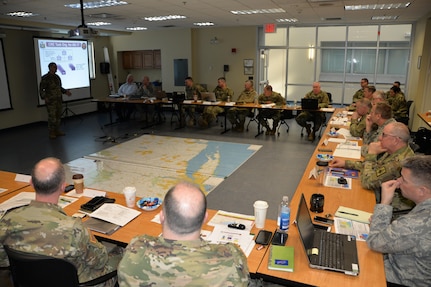 New York National Guard planners and leaders listen as Lt. Col. Michael Tagliafierro discusses task organization during a day-long table top exercise designed to  review New York National Guard actions in the event of an improvised nuclear device attack on New York City held at New York National Guard headquarters in Latham, N.Y. on March 9, 2017.