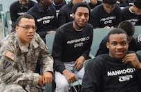 U.S. Army Reserve Staff Sgt. Paul Word, 300th Sustainment Brigade, sits with young men participating in a Steve and Marjorie Harvey Foundation Mentoring Camp in Dallas, TX, on Feb. 4, 2017.  Staff Sgt. Word was selected to mentor a group of young men throughout the event. For the past six years the U.S. Army Reserve has partnered with the Steve and Marjorie Harvey Foundation to provide Soldier-mentors for camps around the country. (U.S. Army Reserve Photo by Maj. Brandon R. Mace)