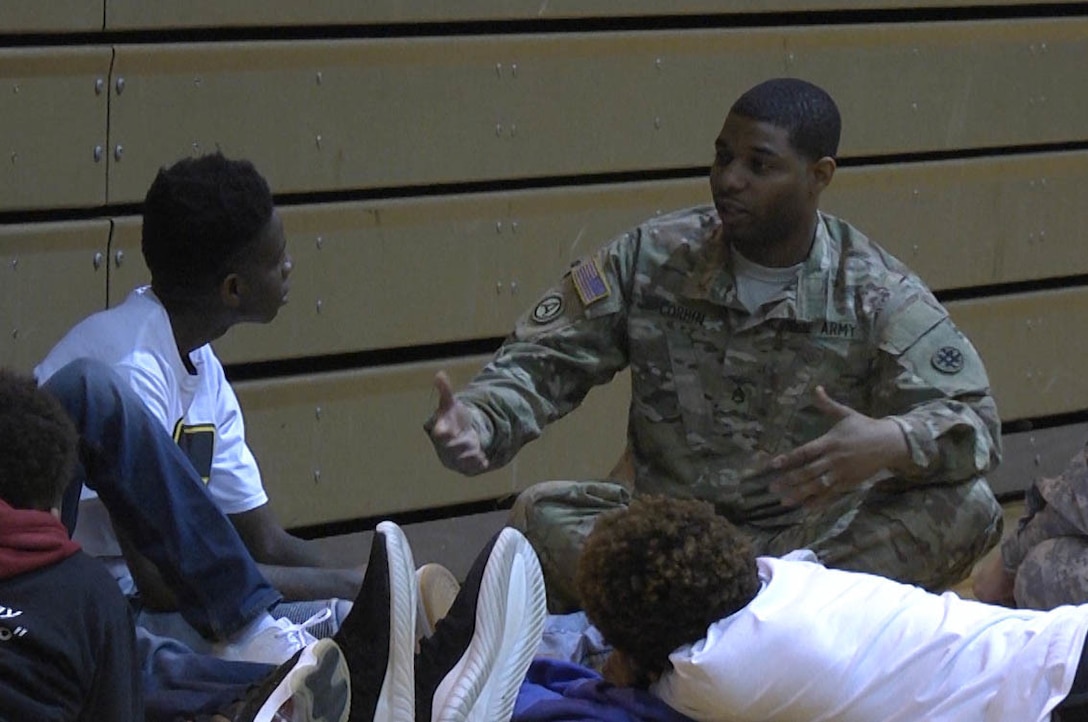 During a Steve and Marjorie Harvey Foundation Mentoring Camp in Dallas, TX, on Feb. 4, 2017, U.S. Army Reserve Staff Sgt. Anthony Corbin, 300th Sustainment Brigade, takes a group of young men through a series of vignettes, helping them rethink the way they approach challenges in their lives.  For the past six years the U.S. Army Reserve has partnered with the Steve and Marjorie Harvey Foundation to provide Soldier-mentors for camps around the country. (U.S. Army Reserve Photo by Maj. Brandon R. Mace)