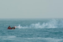Kuwait- Soldiers with Bravo Company, 1-111th Aviation Regiment, Florida, and 77th Combat Aviation Brigade, Arkansas, use a flare to signal the rescue ship during a personnel recovery mission replicating a downed aircraft scenario with the crew of LCU2013 Churubusco- a Landing Craft Utility vessel from Detachment 1, 481st Transportation Company, California, Feb. 13. 
(Photo by Army Sgt. 1st Class Suzanne Ringle/Released)