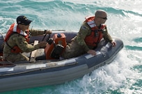 Kuwait-The Soldiers, watercraft operators from the LCU2013 Churubusco- a Landing Craft Utility vessel from Detachment 1, 481st Transportation Company, California, speed to the personnel lost at sea from 77th Combat Aviation Brigade, Arkansas, and Bravo Company, 1-111th Aviation Regiment, Florida, while participating in a personnel recovery training mission replicating a downed aircraft scenario, Feb. 13. 
(Photo by Army Sgt. 1st Class Suzanne Ringle/Released)
