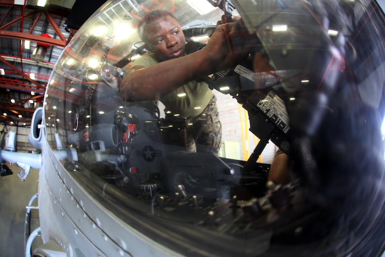 Lance Cpl. Michael Goggins conducts maintenance on a UH-1Y Venom aboard Ft. Drum, N.Y., Mar. 9, 2017. Marines assigned to Marine Light Attack Helicopter Squadron 269, Marine Aircraft Group 29, 2nd Marine Aircraft Wing arrived at Ft. Drum Mar. 8, and will spend more than a week conducting aerial operations in the cold environment. The training will further hone the unit’s ability to operate anywhere around the world in the most austere environments. Goggins is an avionics technician assigned to HMLA-269. (U.S. Marine Corps photo by Cpl. Mackenzie Gibson/Released)