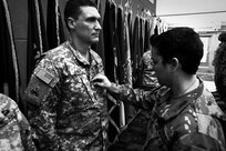 Army Reserve Master Sgt. Jeffrey Ryant, left, G4/construction supervisor, receives the rank of master sergeant from Sergeant Major Kerry Mcallen during a promotion ceremony held at the command's battle assembly weekend, Mar. 4, 2017.
(Photo by Sgt. Aaron Berogan)