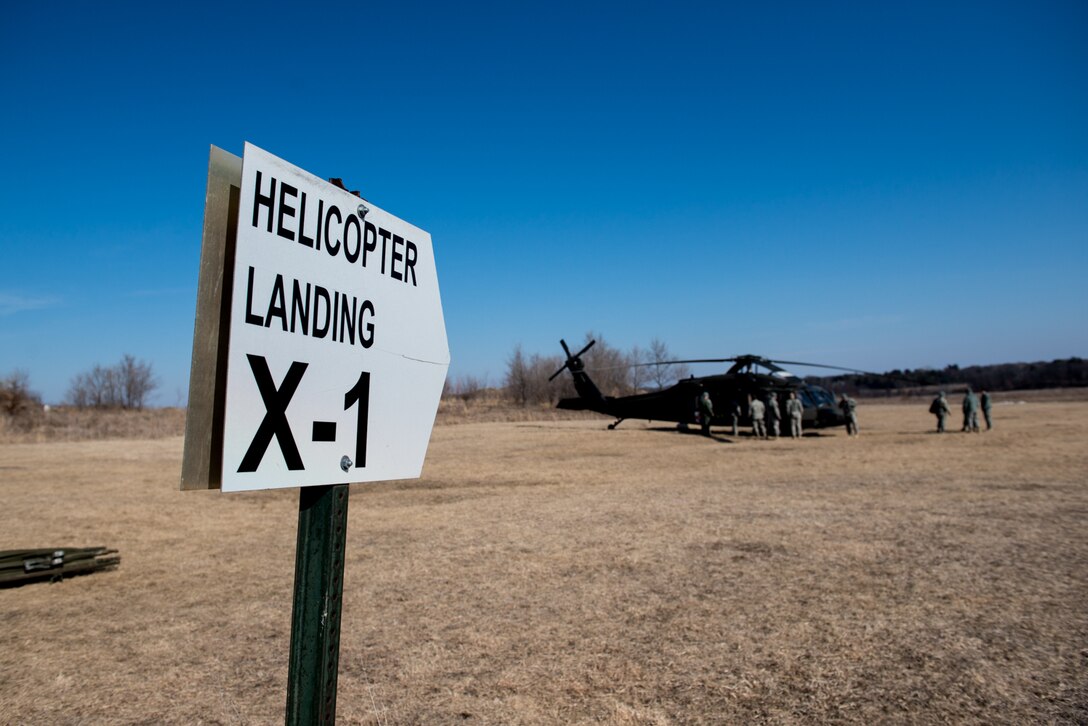 Members of the 934th Aeromedical Evacuation Squadron, 7405th Troop Medical Clinic, and 7212th Medical Support Unit prepare for transporting simulated injured service members during a joint service medical evacuation training on March 4th, 2017 at Arden Hills Army Training Site. (U.S. Air Force photo by Senior Airman Samuel Wacha)