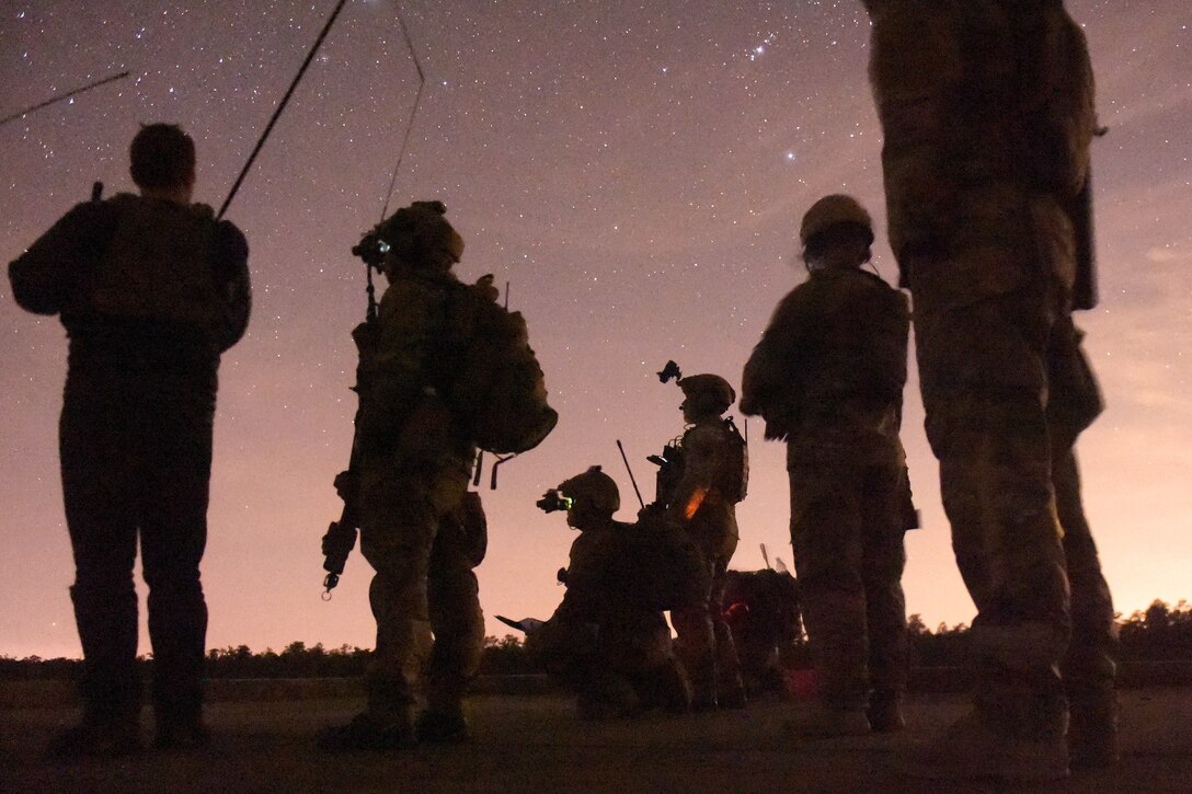 Airmen wait for approaching aircraft during close air support training as part of Emerald Warrior 17 at Eglin Air Force Base, Fla., March 2, 2017. Emerald Warrior is a U.S. Special Operations Command exercise during which joint special operations forces train to respond to threats across the spectrum of conflict. Air Force photo by Tech. Sgt. Barry Loo