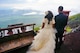 U.S. Air Force Capt. Renee Cassidy, the 509th Maintenance Operations officer in charge, and her husband of nearly four years, Capt. Justin Cassidy, the 13th Aircraft Maintenance Unit officer in charge, look out toward Okinawa after climbing Mount Fuji in Japan, in May 2013. After climbing to the 8th station of the Yoshida Trail, the Cassidys posed for their wedding photos before changing back in to their gear and continuing on up to the summit. (Courtesy photo)