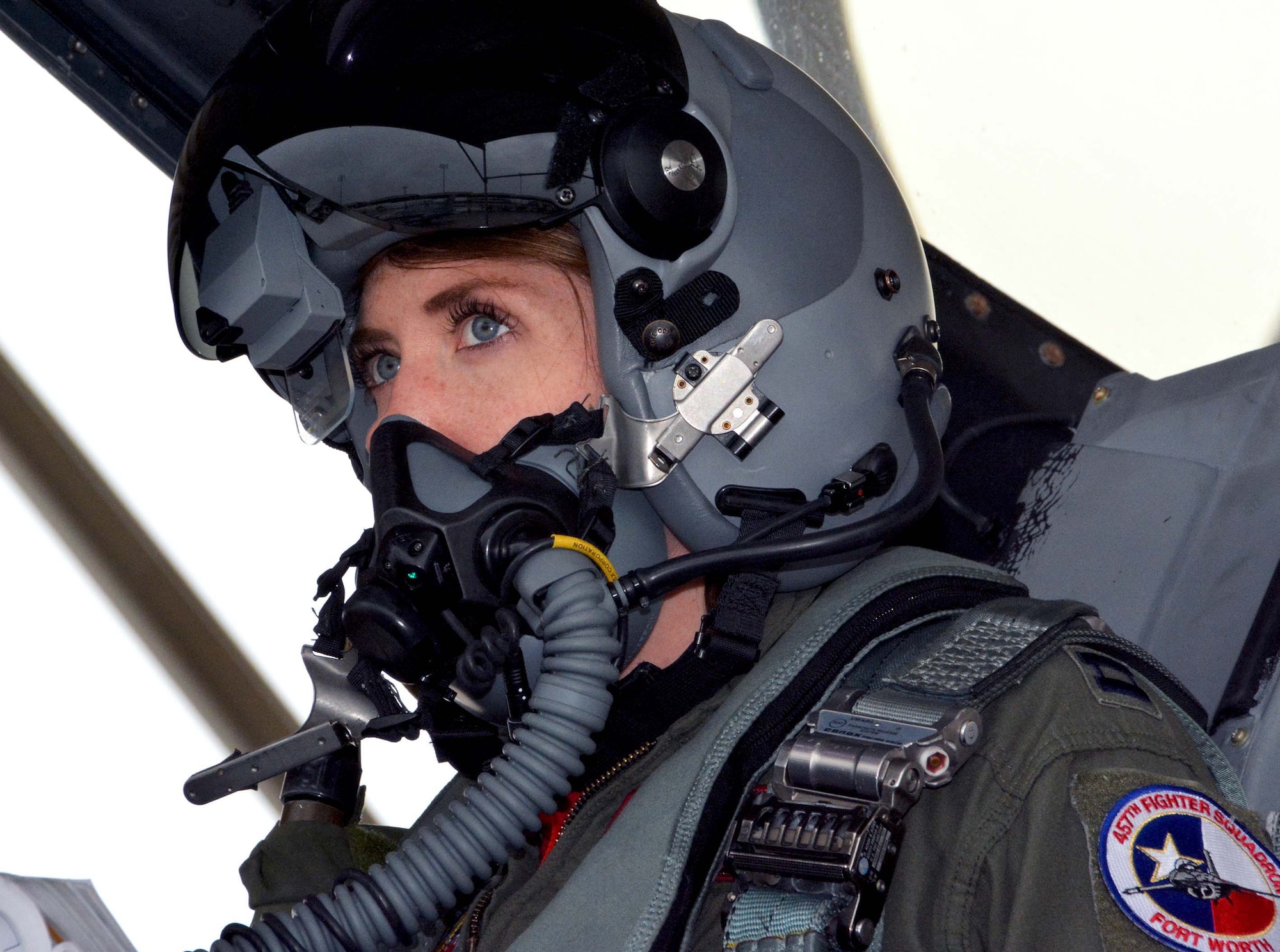 Capt. Michelle “Mace” Curran, 355th Fighter Squadron F-16 pilot, looks up during fighter jet launch preparations on the flightline, Mar. 4, 2017. Curran was the first woman assigned to fly in the 355th FS and attributed her success to her parents, leadership and strong women in aviation past and present who’ve helped pave the way. (U.S. Air Force photo by Staff Sgt. Samantha Mathison)