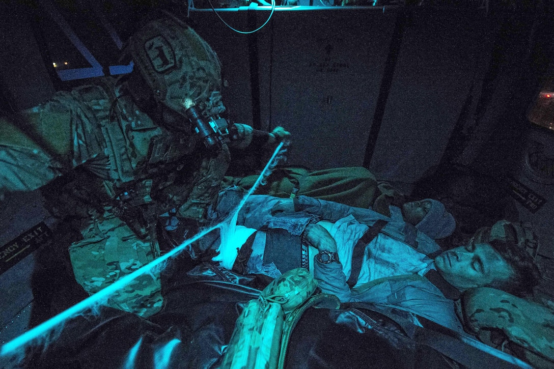 An airman provides medical aid to a roleplayer with simulated injuries during Emerald Warrior 17 at Hurlburt Field, Fla., March 2, 2017. Air Force photo by Staff Sgt. Corey Hook