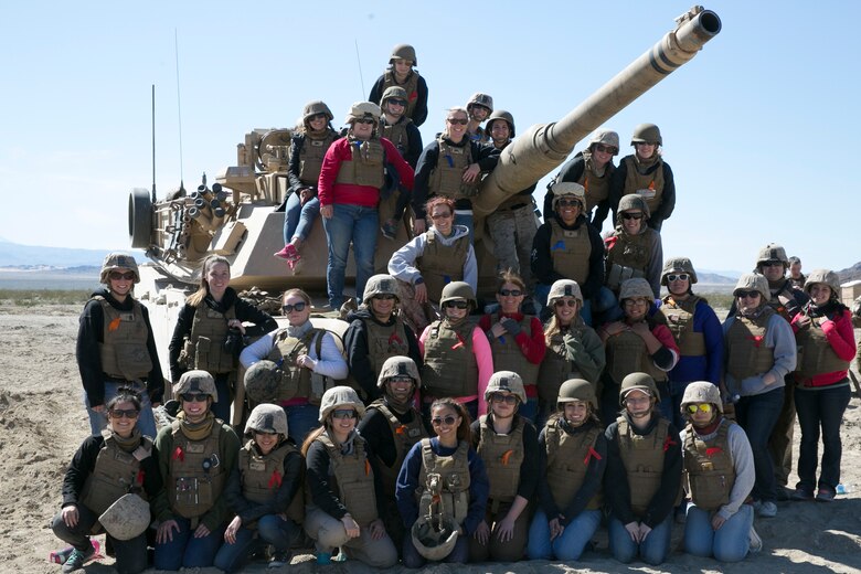 Amanda Boos, wife of Capt. Jonathon Boos, 1st Tank Battalion, sits on an M1A1 Abrams Main Battle Tank during the battalion’s Jane Wayne Day at Range 500 aboard Marine Corps Air Ground Combat Center, Twentynine Palms, Calif., March 2, 2017. The event is held to bolster unit cohesion while allowing the spouses to see what their Marines and sailors do on a daily basis. (U.S. Marine Corps photo by Cpl. Julio McGraw)
