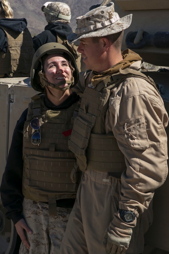 Amanda Boos, wife of Capt. Jonathon Boos, 1st Tank Battalion, talks to her husband during the battalion’s Jane Wayne Day at Range 500 aboard Marine Corps Air Ground Combat Center, Twentynine Palms, Calif., March 2, 2017. The event is held to bolster unit cohesion while allowing the spouses to see what their Marines and sailors do on a daily basis. (U.S. Marine Corps photo by Cpl. Julio McGraw)