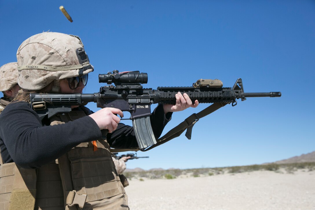 Codi Trifiro, wife of Lance Cpl. Shane Trifiro, 1st Tank Battalion, shoots an M4 Carbine during the battalion’s Jane Wayne Day at Range 500 aboard Marine Corps Air Ground Combat Center, Twentynine Palms, Calif., March 2, 2017. The event is held to bolster unit cohesion while allowing the spouses to see what their Marines and sailors do on a daily basis. (U.S. Marine Corps photo by Cpl. Julio McGraw)