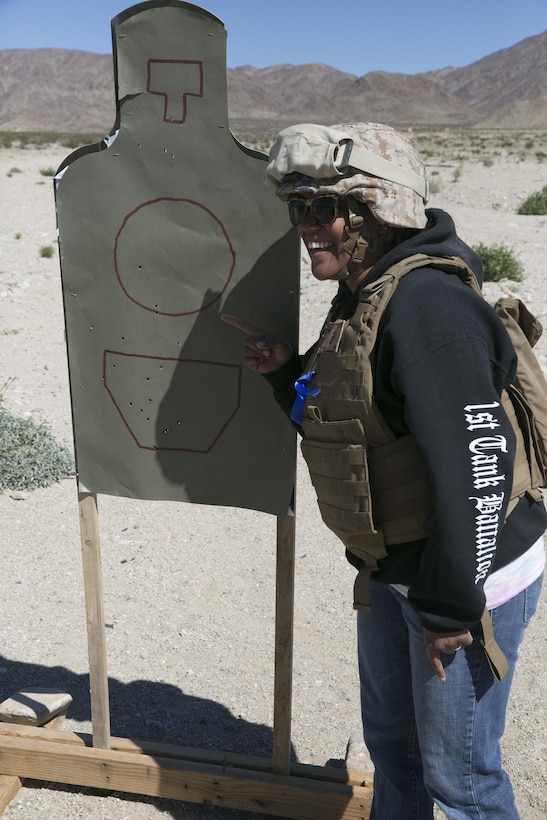 Vivid Linares, wife of Staff Sgt. Samuel Linares, supply chief, 1st Tank Battalion, displays her shot group during the battalion’s Jane Wayne Day at Range 500 aboard Marine Corps Air Ground Combat Center, Twentynine Palms, Calif., March 2, 2017. The event is held to bolster unit cohesion while allowing the spouses to see what their Marines and sailors do on a daily basis. (U.S. Marine Corps photo by Cpl. Julio McGraw)