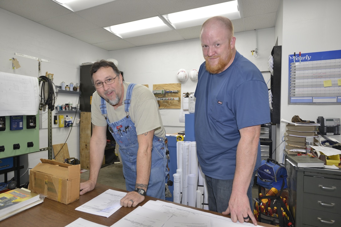 Larry Cole, power plant electrician serving at Old Hickory Powerhouse, shows Nick Pilcher, an electrician trainee an upcoming project at the Old Hickory Power Plant.  Cole is the U.S. Army Corps of Engineers Nashville District Employee of the Month for January 2017.   