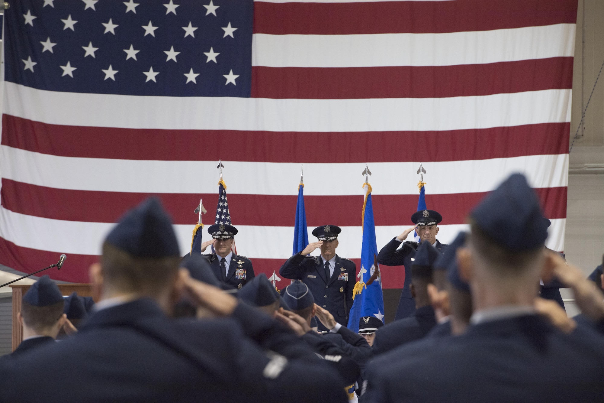 U.S. Air Force Chief of Staff Gen. David L. Goldfein, General Hawk Carlisle, former commander, Air Combat Command, and Gen. James M. Holmes, Commander, ACC, salute during ACC’s Change of Command ceremony at Joint Base Langley-Eustis, Va., March 10, 2017. Holmes assumed command from Carlisle, who retired after 39 years of service to the Air Force. (U.S. Air Force photo by Staff Sgt. Nick Wilson)