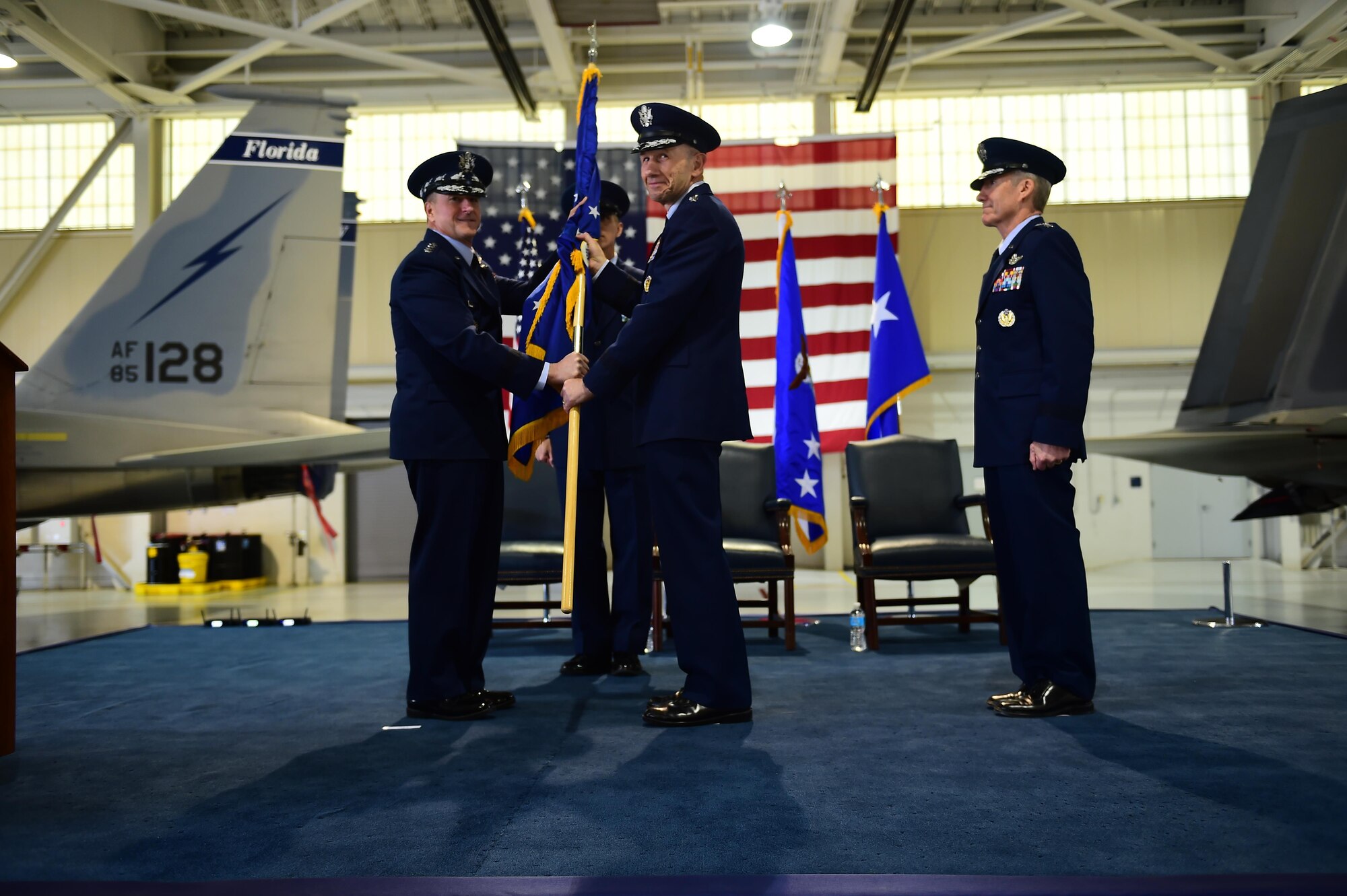 U.S. Air Force Chief of Staff Gen. David L. Goldfein passes the Air Combat Command guidon to Gen. James M. Holmes during ACC’s Change of Command ceremony at Joint Base Langley-Eustis, Va., March 10, 2017. Holmes assumed command from Gen. Herbert “Hawk” Carlisle, who retired after 39 years of service to the Air Force. (U.S. Air Force photo/Senior Airman Kimberly Nagle)