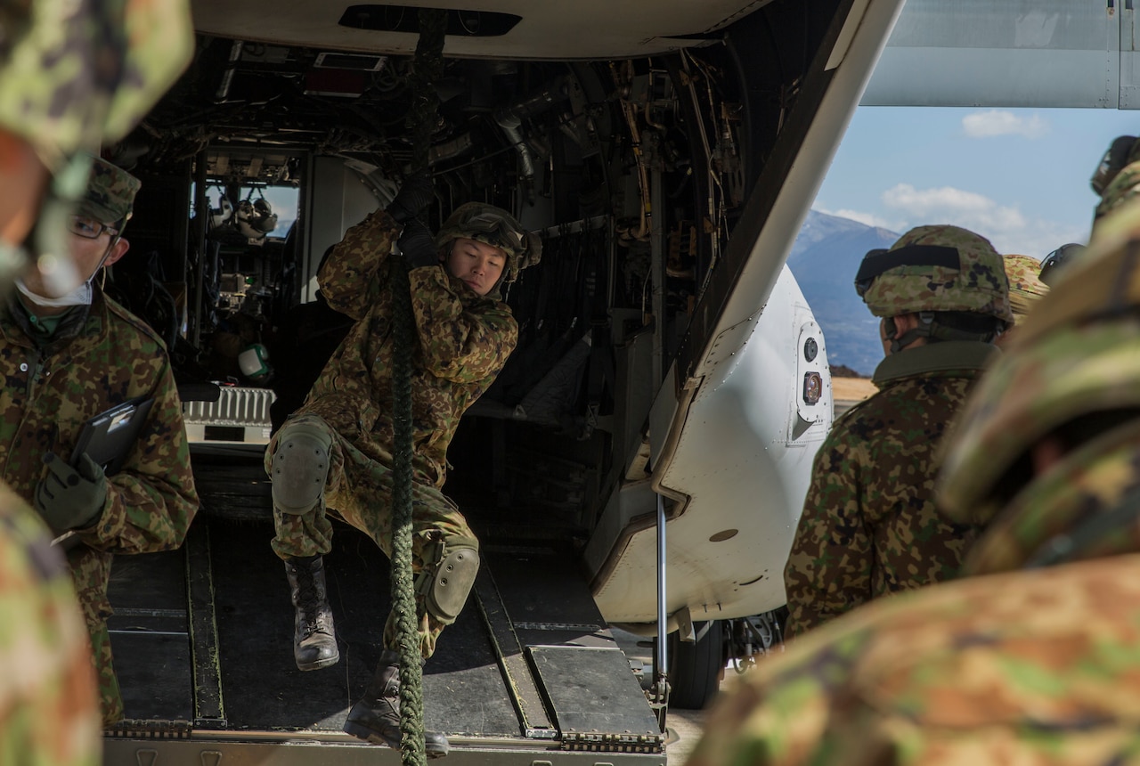 A member of the Japanese Ground Self-Defense Force, 30th Infantry Regiment, 12th Brigade, Eastern Army, practices fast roping from an MV-22B Osprey tiltrotor aircraft  during Forest Light 17-1 at Camp Soumagahara on Mar. 9, 2017. Forest Light is a routine, semi-annual exercise conducted by U.S. and Japanese forces in order to strengthen interoperability and combined capabilities in defense of the U.S.-Japanese alliance. (U.S. Marine Corps photo by Cpl. Kelsey Dornfeld)