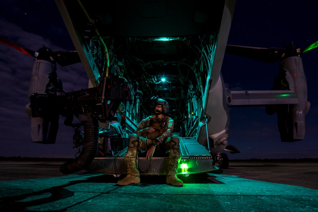 A special missions aviator from the 8th Special Operation Squadron rest on the ramp of a CV-22 Osprey at Avon Park, Fla., on March 7, 2017 during Emerald Warrior 17. Emerald Warrior is a U.S. Special Operations Command exercise during which joint special operations forces train to respond to various threats across the spectrum of conflict. (U.S. Air Force photo/Airman 1st Class Keifer Bowes)
