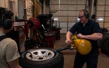 (From left) Airman Steven Velasquez and Senior Airman Nicholas Oukrop, 5th Logistics Readiness Squadron vehicle maintenance technicians, separate a tire from its rim at Minot Air Force Base, N.D., Feb. 28, 2017. The tire shop maintainers are responsible for ensuring all government vehicle tires remain in serviceable condition. (U.S. Air Force photo/Airman 1st Class Jonathan McElderry)
