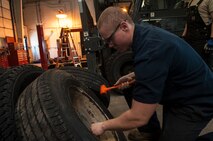 Senior Airman Nicholas Oukrop, 5th Logistics Readiness Squadron vehicle maintenance technician, removes beads from a tire at Minot Air Force Base, N.D., Feb. 28, 2017. The tire shop ensures all government vehicle’s readiness by performing daily tire maintenance. (U.S. Air Force photo/Airman 1st Class Jonathan McElderry)