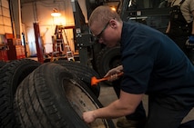 Senior Airman Nicholas Oukrop, 5th Logistics Readiness Squadron vehicle maintenance technician, removes beads from a tire at Minot Air Force Base, N.D., Feb. 28, 2017. The tire shop ensures all government vehicle’s readiness by performing daily tire maintenance. (U.S. Air Force photo/Airman 1st Class Jonathan McElderry)