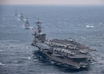 The aircraft carrier USS Carl Vinson (CVN 70), foreground, transits the East China Sea with the Japan Maritime Self-Defense Force Takanami-class destroyer JS Sazanami (DD 113), middle first, the Japan Maritime Self-Defense Force Murasame-class destroyer JS Samidare (DD 106), middle second, and the Arleigh Burke-class guided-missile destroyer USS Wayne E. Meyer (DDG 108) Mar. 9, 2017. The Carl Vinson Carrier Strike Group is on a regularly scheduled Western Pacific deployment as part of the U.S. Pacific Fleet-led initiative to extend the command and control functions of U.S. 3rd Fleet. U.S. Navy aircraft carrier strike groups have patrolled the Indo-Asia-Pacific regularly and routinely for more than 70 years.