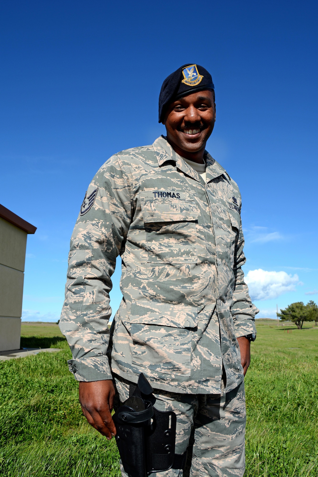 Staff Sgt. Dante Thomas, 349th Security Forces Squadron member, poses for a photo outside of the combat arms building at Travis Air Force Base, Calif., on March 9, 2017. Thomas recently took part in Exercise Cope North 2017 in Guam. He and Staff Sgt. Rochelle Waters, another 349 SFS member, saved the life of a drowning child during an off-day on the assignment. (U.S. Air Force photo/Staff Sgt. Daniel Phelps)