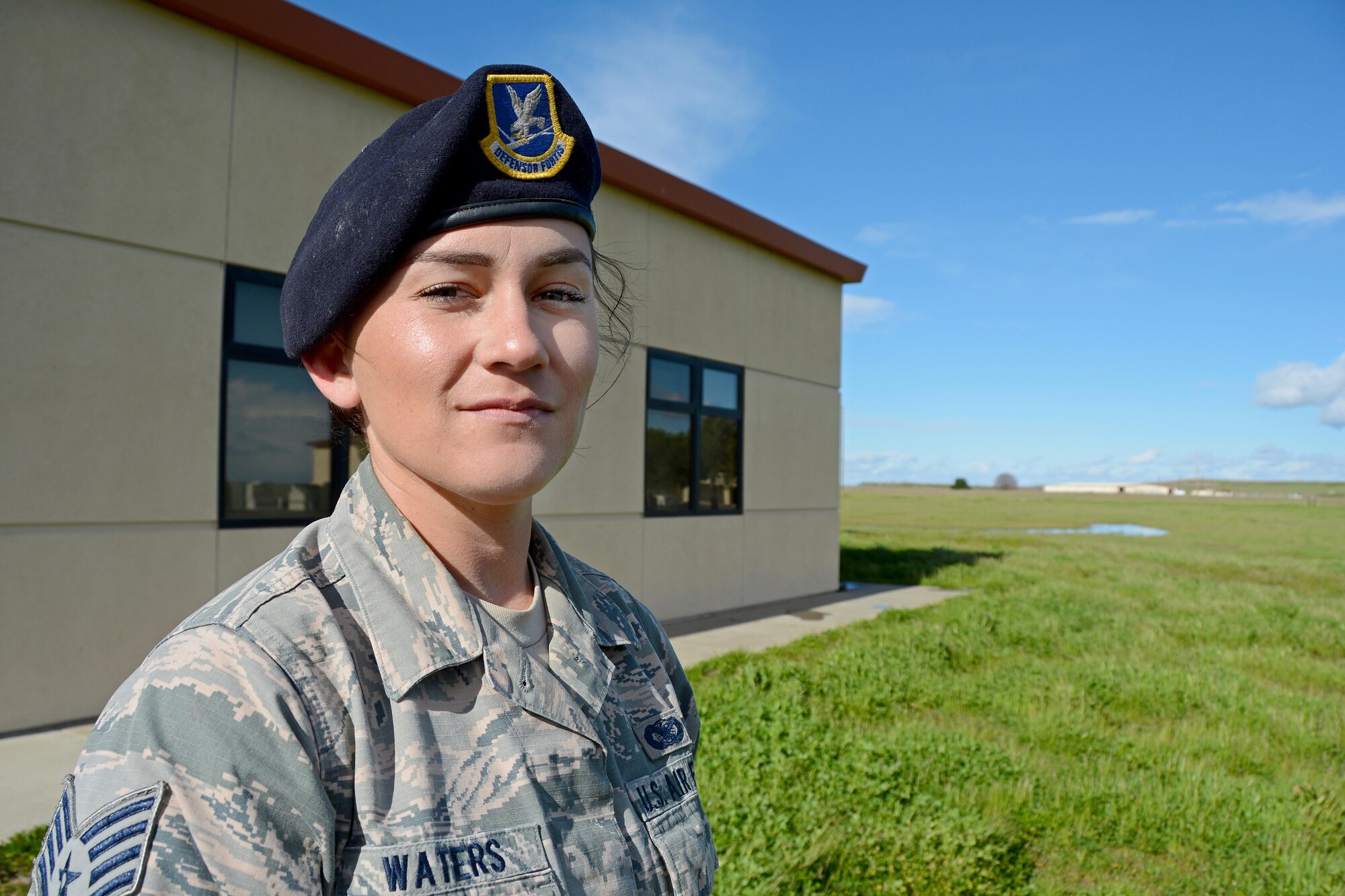 Staff Sgt. Rochelle Waters, 349th Security Forces Squadron member, poses for a photo outside of the combat arms building at Travis Air Force Base, Calif., on March 9, 2017. Waters recently took part in Exercise Cope North 2017 in Guam. She and Staff Sgt. Dante Thomas, another 349 SFS member, saved the life of a drowning child during an off-day on the assignment. (U.S. Air Force photo/Staff Sgt. Daniel Phelps)